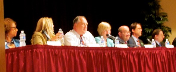 Your photographer failed repeatedly to squeeze all eight candidates into a  photo.
