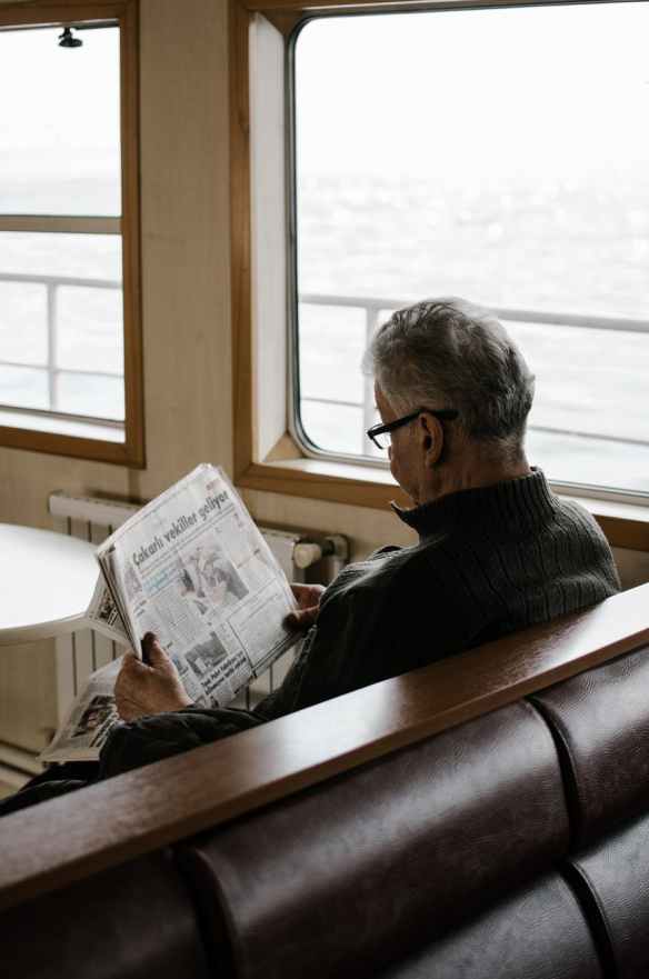 man reading a newspaper